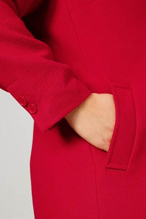 Manteau court en matière texturée, avec revers et manches longues