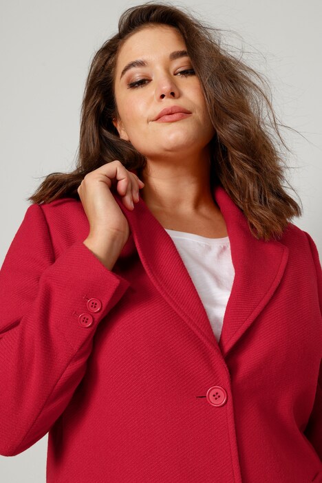 Manteau court en matière texturée, avec revers et manches longues