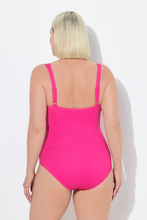 Maillot de bain avec bonnets souples. Joli drapé sur la poitrine. Matière finement texturée.