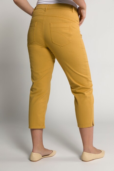 Jean 7/8 en coton bio. Bas de jambe fendu. Taille confortable.