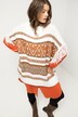 Poncho oversize, motif ethnique, franges