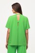 T-shirt à manches courtes. Profondes découpes. Décolleté rond.