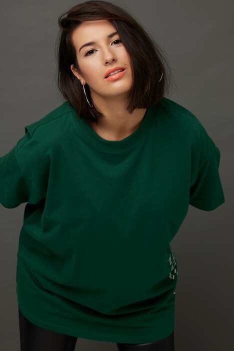 T-shirt oversized, à manches courtes. Décolleté rond. Message imprimé.