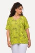 T-shirt à manches courtes. Coupe oversized. Décolleté en V et imprimé feuilles de palmiers.