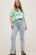 Jeans a vita alta dal taglio dritto a cinque tasche con spacchetto sull'orlo interno