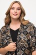 Veste kimono à manches courtes. Coupe oversized. Paillettes métallisées.