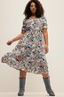 Robe midi à col en V et manches courtes. Ligne en A, motif imprimé et volant.