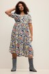 Robe midi à col en V et manches courtes. Ligne en A, motif imprimé et volant.