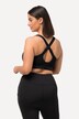 Soutien-gorge de sport, sans armatures. Bretelles croisées et fermeture à glissière.