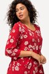 T-shirt long, motif à fleurs. Col rond et manches 3/4. Ligne en A.