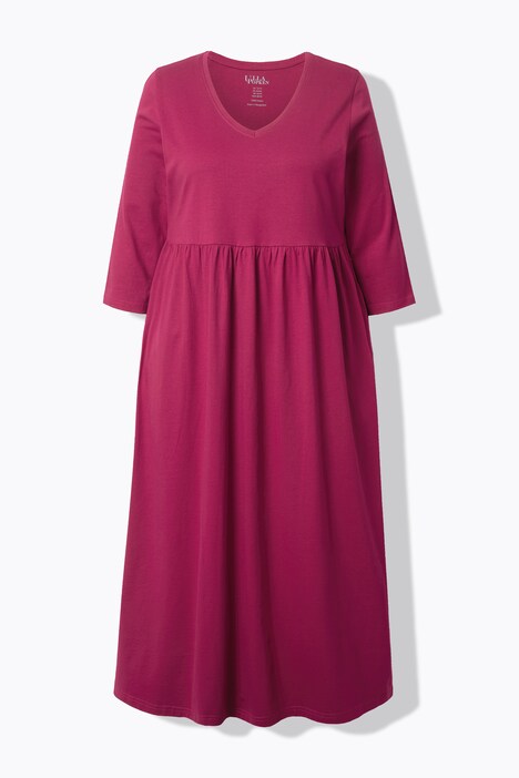 Robe en jersey, couture empire. Décolleté en V et manches 3/4. Poches