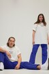 Pantalon d'aviateur unisexe. Jambe large et taille élastique. Plis aux genoux et cordons de serrage aux chevilles