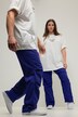 Pantalon d'aviateur unisexe. Jambe large et taille élastique. Plis aux genoux et cordons de serrage aux chevilles