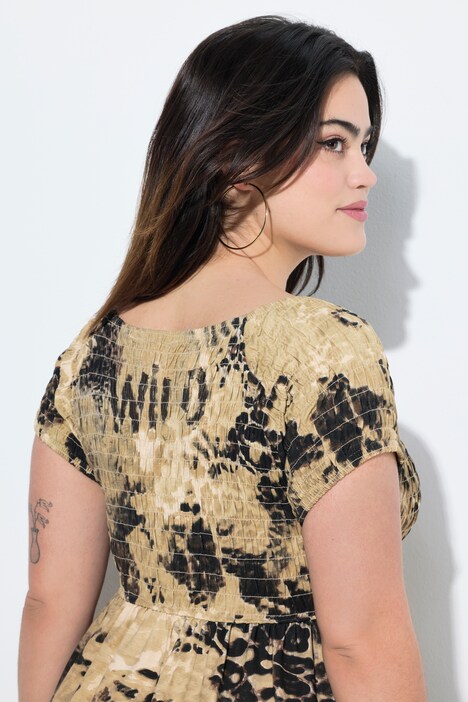 Robe maxi en jersey, mélange d'imprimés léopard, corsage smocké et coupe évasée