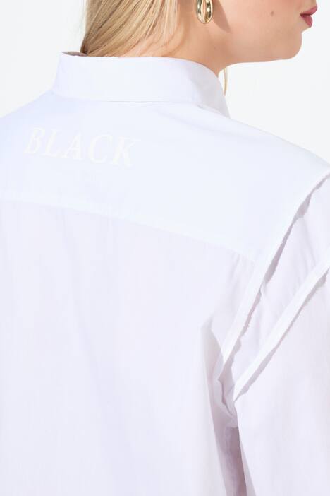 Camicia dal taglio oversize con cuciture a rovescio e maniche lunghe