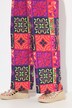 Pantalon Palazzo jambe large, ceinture élastique, motif esprit « carreaux de faïence »