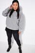Sweat oversize. Effet pailleté et message imprimé