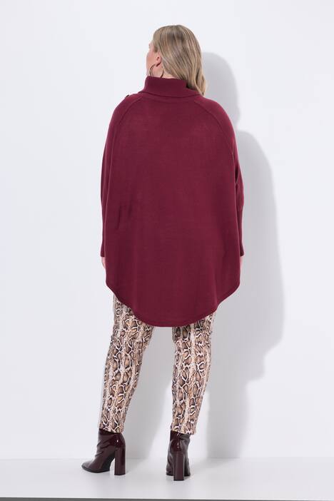 Poncho style cable pattern pointed hem sweater