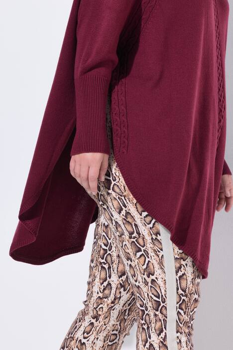 Poncho style cable pattern pointed hem sweater