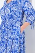 Robe midi, coupe évasée. Cordon de serrage sous tunnel. Décolleté V et manches 3/4