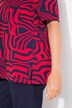 T-shirt à manches courtes et col tunisien. Coupe évasée