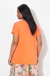 T-shirt oversize en tissu fluide. Décolleté V et manches courtes