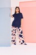 Pantalon en jersey à motif floral. Jambe droite et large. Taille élastique