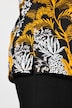 T-shirt à motif palmiers. Manches courtes et col tunisien. Coupe évasée