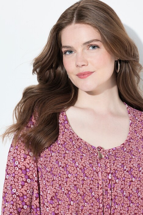 Blouse smockée, motif à fleurs, décolleté rond et manches 3/4, coupe évasée