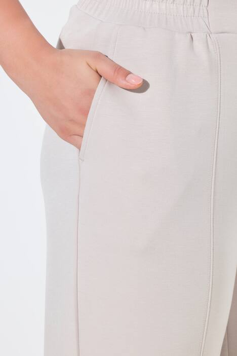 Pantalon en molleton, jambe large et droite, passepoils et taille élastique