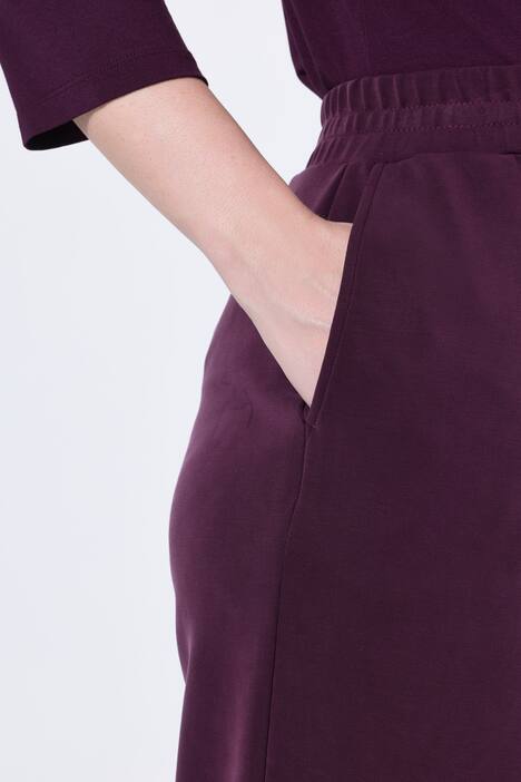 Pantalon en molleton, jambe large et droite, passepoils et taille élastique