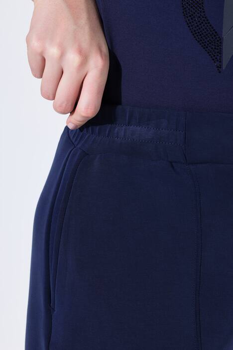Pantalon en molleton, jambe large et droite, passepoils et taille élastique