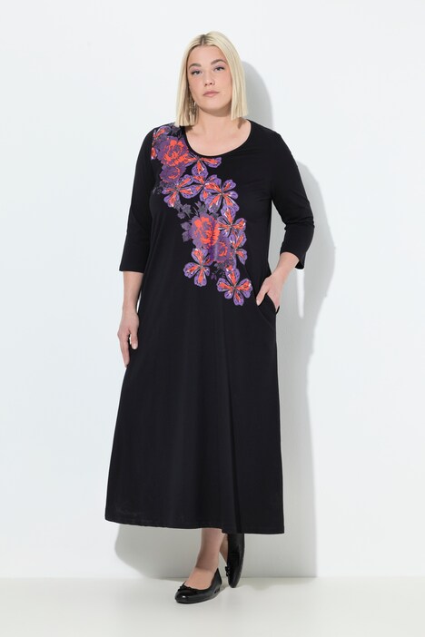 Robe en jersey, motif à fleurs. Col rond et manches 3/4. Coupe évasée