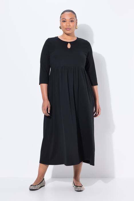 Robe maxi en jersey, poches, décolleté rond et manches 3/4, coupe évasée