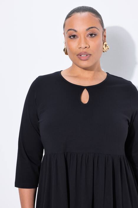 Robe maxi en jersey, poches, décolleté rond et manches 3/4, coupe évasée