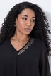 Blouse en mousseline doublée, décolleté en V et manches courtes, coupe évasée