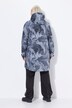 Veste de pluie imperméable, capuche et fermeture zippée de chaque côté, coupe évasée