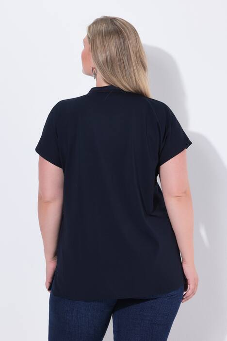 Camiseta tipo blusa, con una mitad de lentejuelas en la parte delantera, espalda de jersey