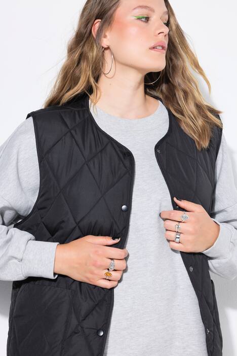 Chaleco acolchado ligero, forma oversize, botones automáticos