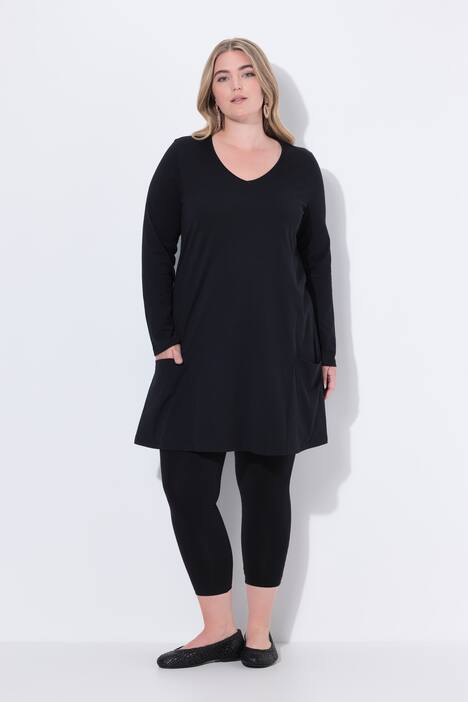 Maglia dal taglio lungo e svasato con tasche, scollo a V e maniche lunghe