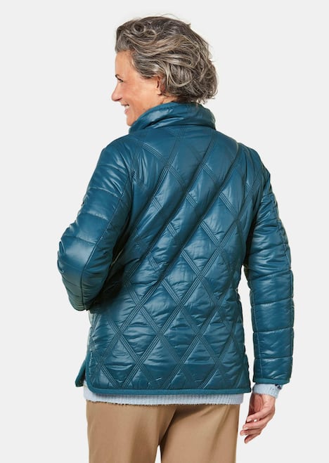 Gewatteerd jack met decoratieve drukknopen