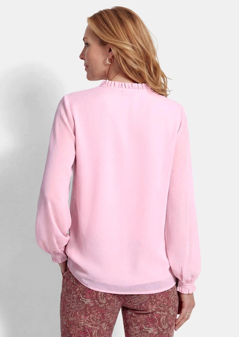 Vrouwelijke blouse met ruches