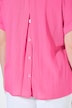 Blouse à manches courtes, boutons dans le dos et pli fantaisie. Coupe oversize.