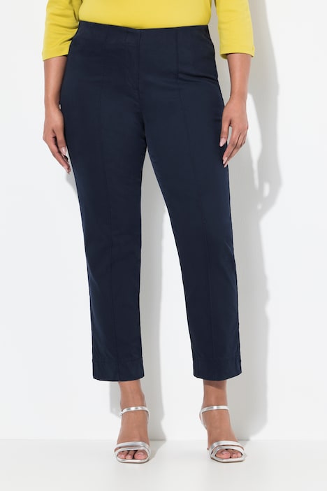 Pantalon avec passepoil et taille élastique. Coupe ajustée avec fente sur le bas de jambe.