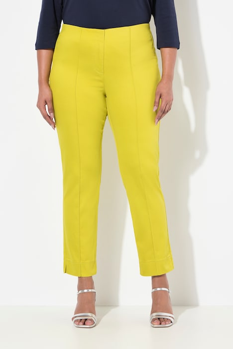 Pantalon avec passepoil et taille élastique. Coupe ajustée avec fente sur le bas de jambe.