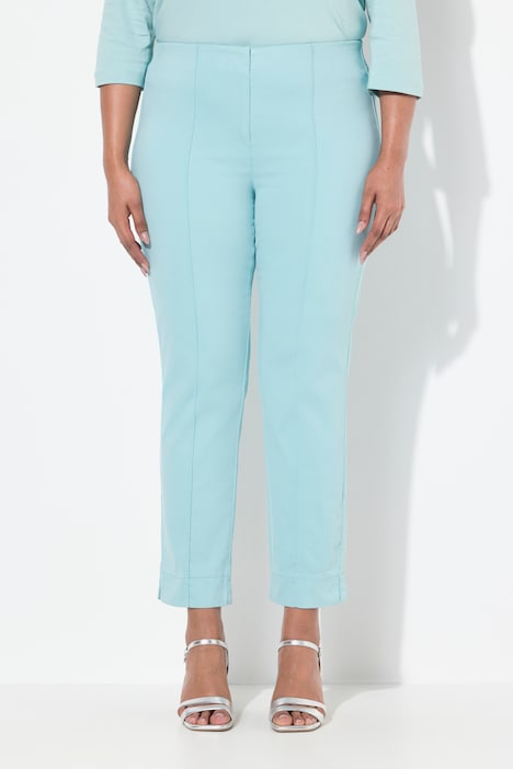 Pantalon avec passepoil et taille élastique. Coupe ajustée avec fente sur le bas de jambe.