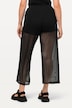 Pantalon en tulle transparent. Taille élastique, jambe large.