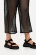 Pantalon en tulle transparent. Taille élastique, jambe large.
