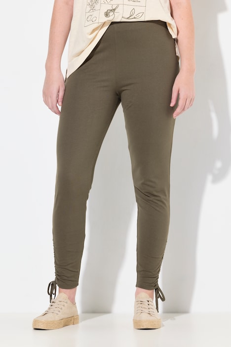 Legging en coton bio. Taille élastique et bas de jambe avec fronces.