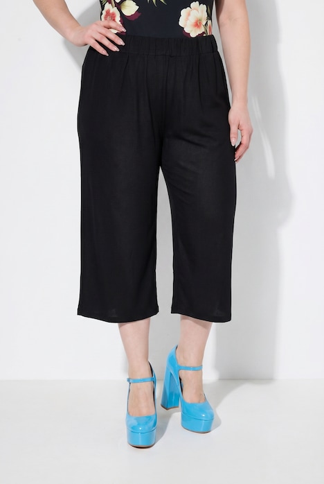 Jupe-culotte en maille fluide. Longueur mollet, jambe large. Taille élastique